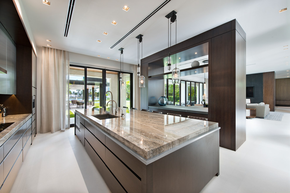 Large contemporary galley eat-in kitchen in Miami with a drop-in sink, louvered cabinets, grey cabinets, marble benchtops, brown splashback, timber splashback, stainless steel appliances, travertine floors, with island and white floor.