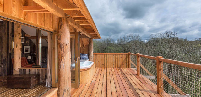 Treehouse Holiday Accommodation at Wolf Woods Devon rustic-deck