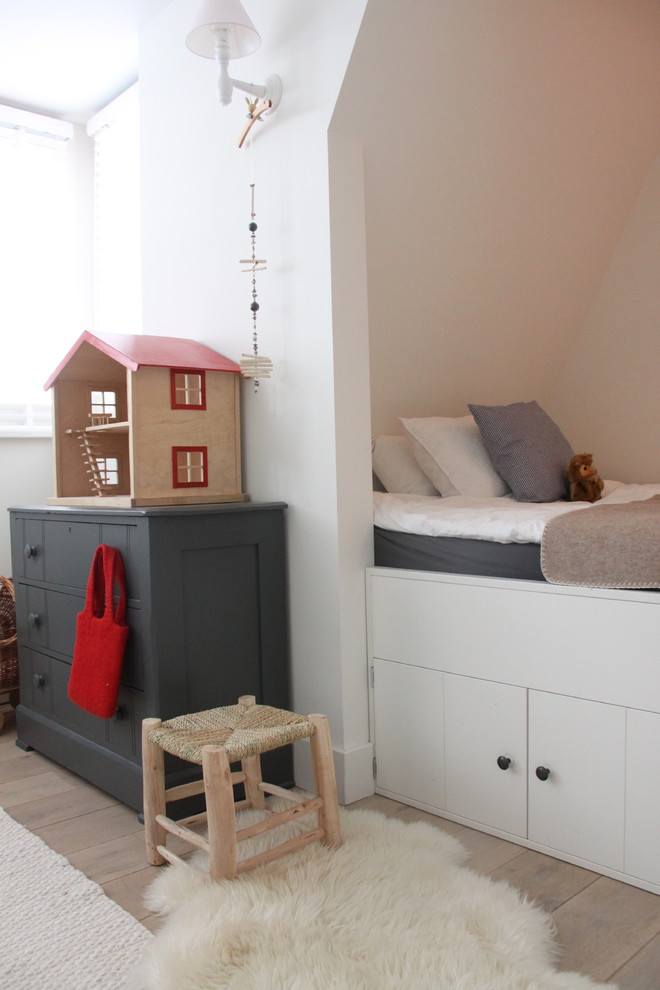 Contemporary kids' room in Amsterdam with white walls.
