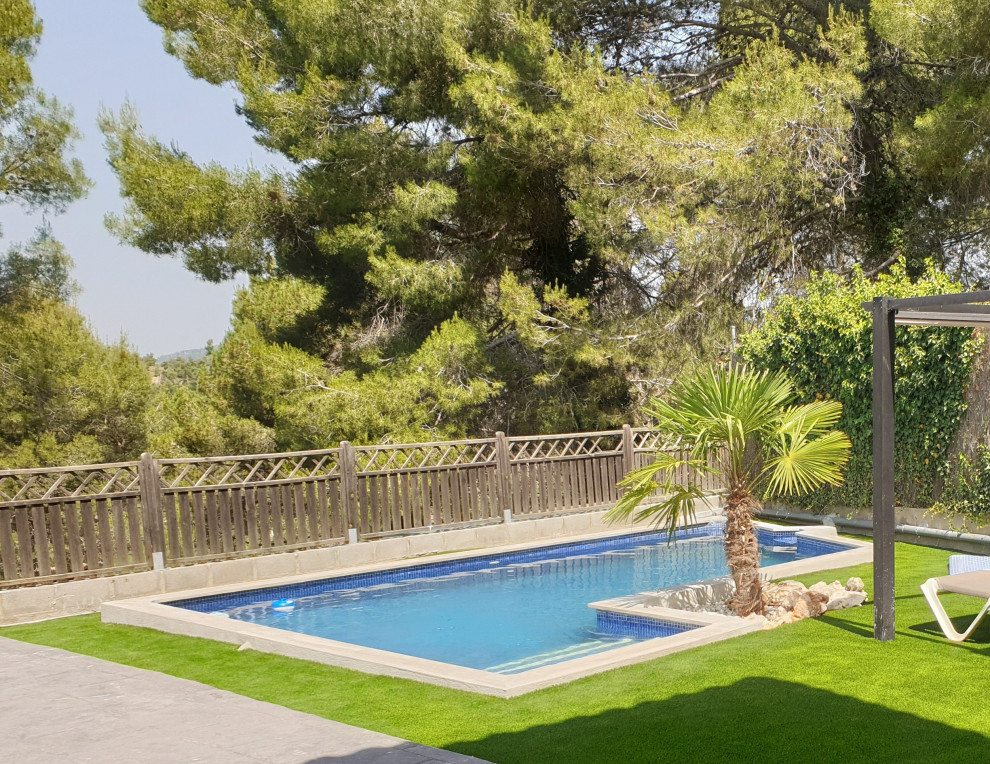 Large mediterranean front yard rectangular pool in Other.