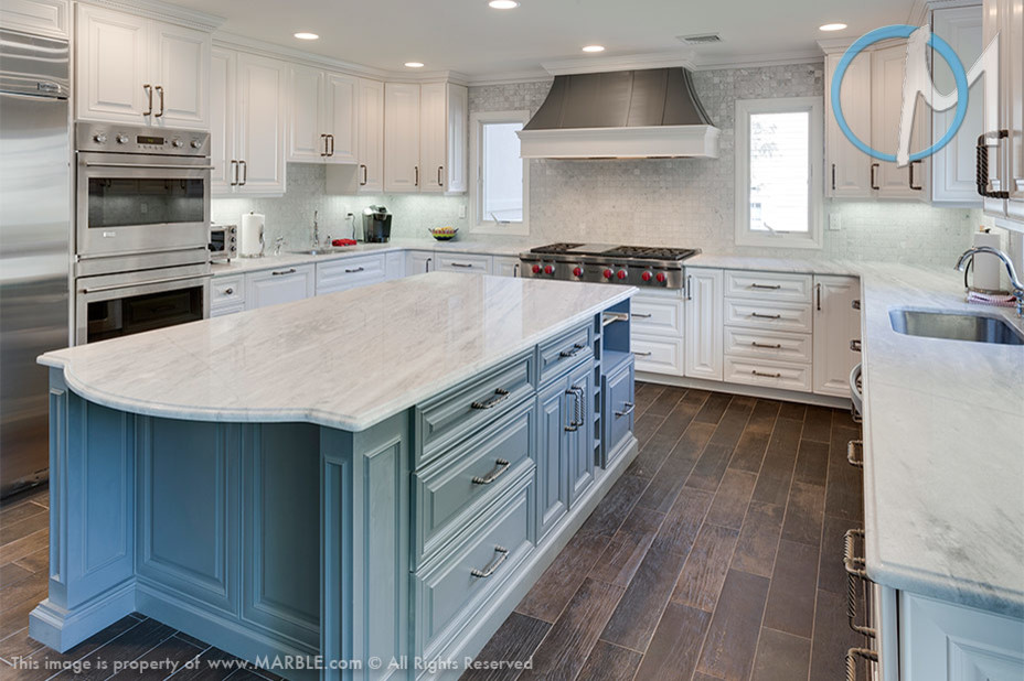 Eat-in kitchen - large contemporary l-shaped eat-in kitchen idea in New York with an undermount sink, white cabinets, quartzite countertops, white backsplash, stainless steel appliances and an island