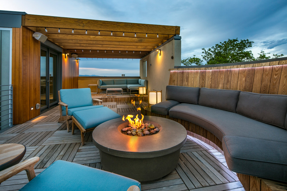 Design ideas for a large contemporary rooftop deck in Denver with a fire feature and a pergola.