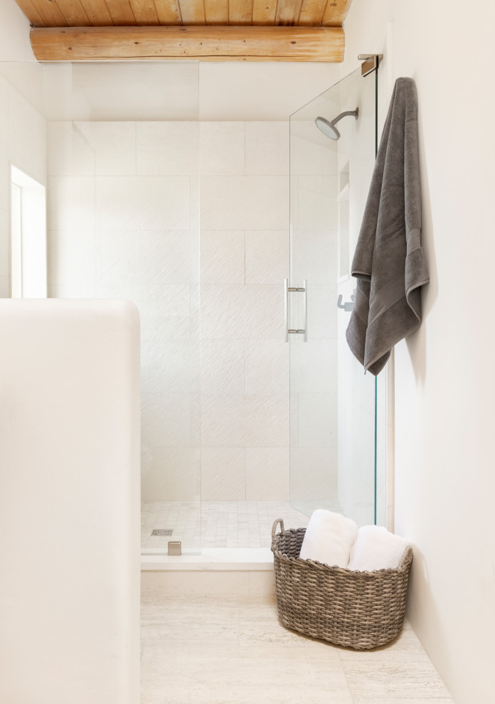 Mid-sized southwest 3/4 porcelain tile, beige floor, single-sink and wood ceiling wet room photo in Albuquerque with flat-panel cabinets, a hinged shower door and a built-in vanity