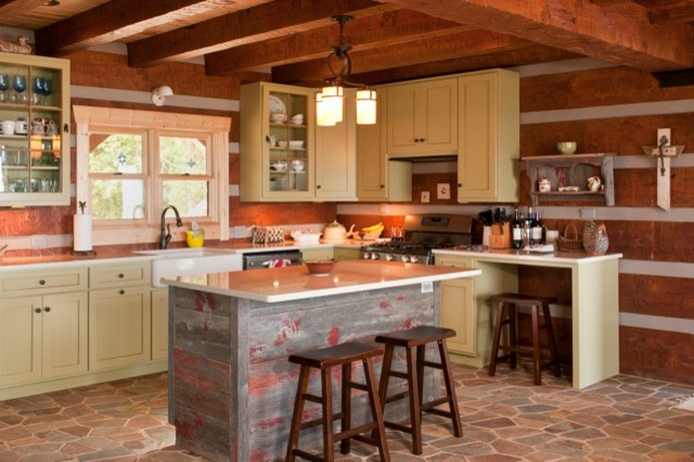 Open concept kitchen - large rustic slate floor open concept kitchen idea with a drop-in sink, shaker cabinets, green cabinets, quartzite countertops, brown backsplash and an island