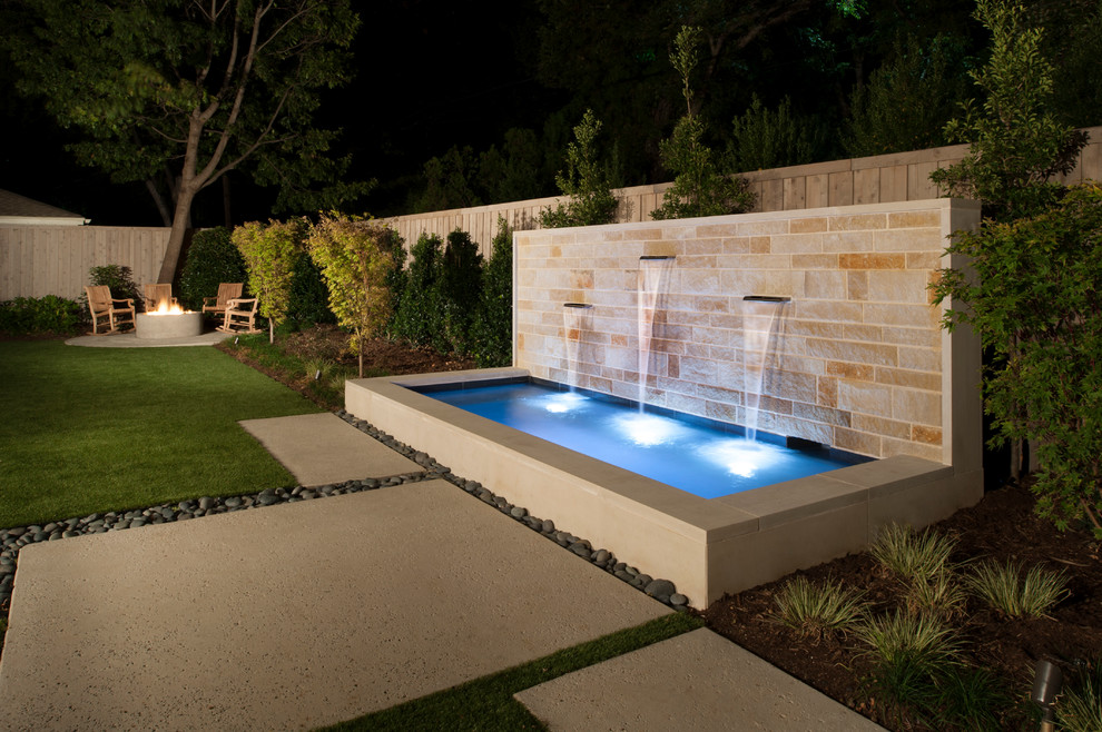 Small modern backyard rectangular pool in Dallas with a hot tub and concrete pavers.