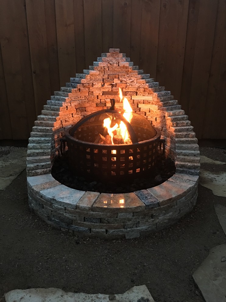 Patio - small craftsman backyard stone patio idea in Dallas with a fire pit and no cover