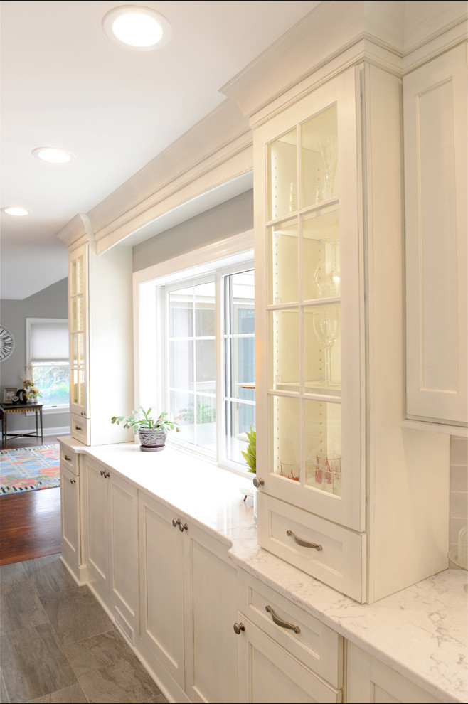Example of a transitional kitchen design in New York