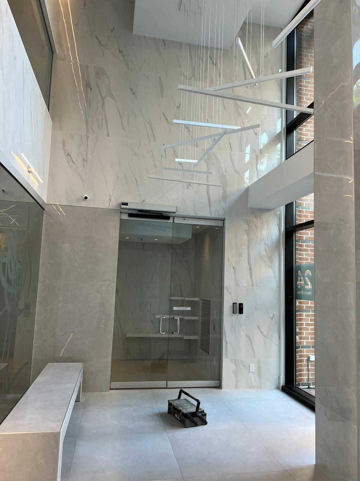 Demolition: Removal of old finishes, including flooring, walls, and outdated fixtures. The space is cleared to create a fresh start for the renovation.