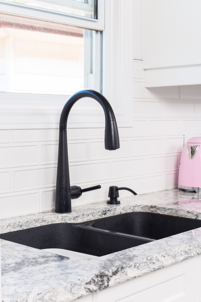 Inspiration for a mid-sized transitional galley porcelain tile and gray floor eat-in kitchen remodel with a double-bowl sink, shaker cabinets, white cabinets, granite countertops, white backsplash, subway tile backsplash, stainless steel appliances, no island and gray countertops