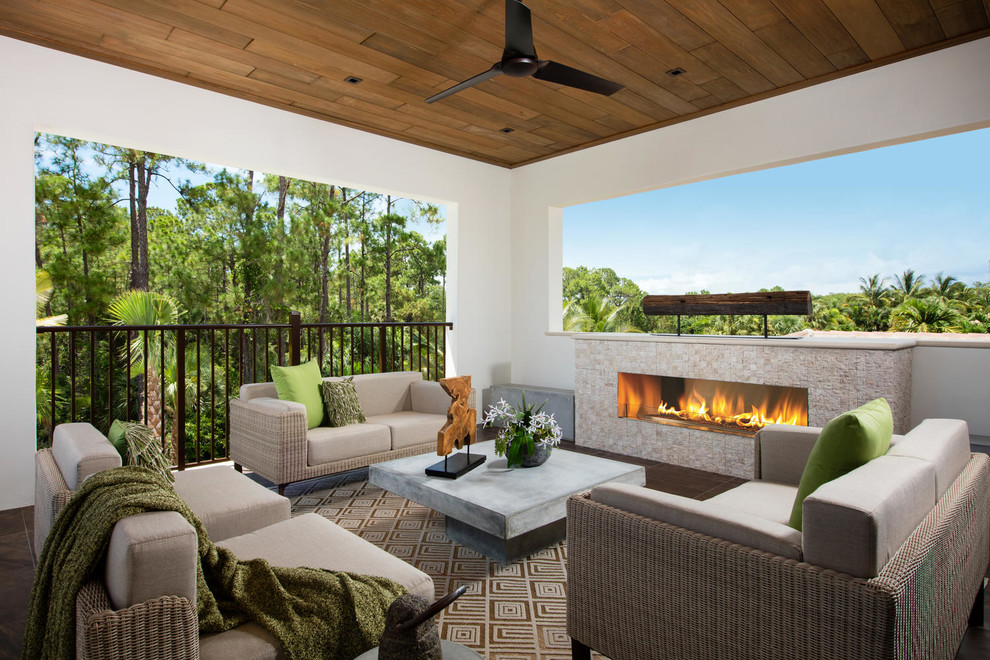 Tuscan metal railing balcony photo in Miami with a fire pit