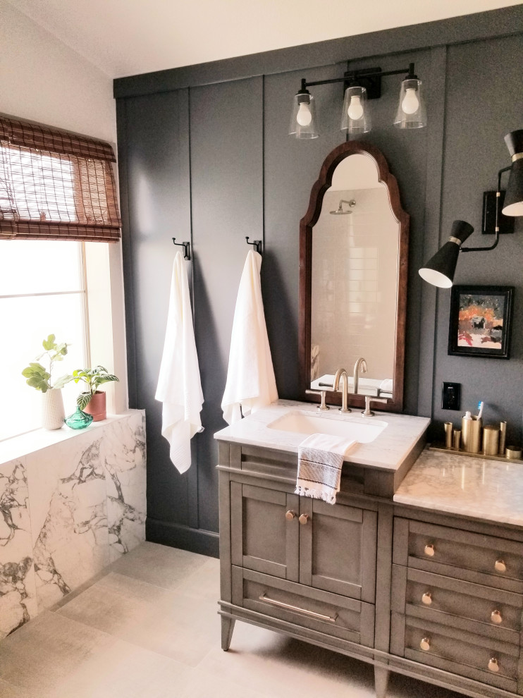 Photo of a large traditional master bathroom in Phoenix with shaker cabinets, grey cabinets, an open shower, a one-piece toilet, white tile, porcelain tile, grey walls, porcelain floors, an undermount sink, marble benchtops, grey floor, an open shower, white benchtops, a double vanity, a freestanding vanity and decorative wall panelling.