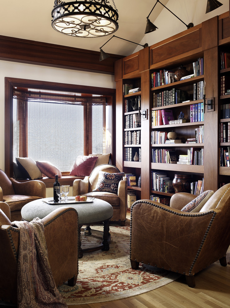 Photo of a traditional living room in San Diego with a library.