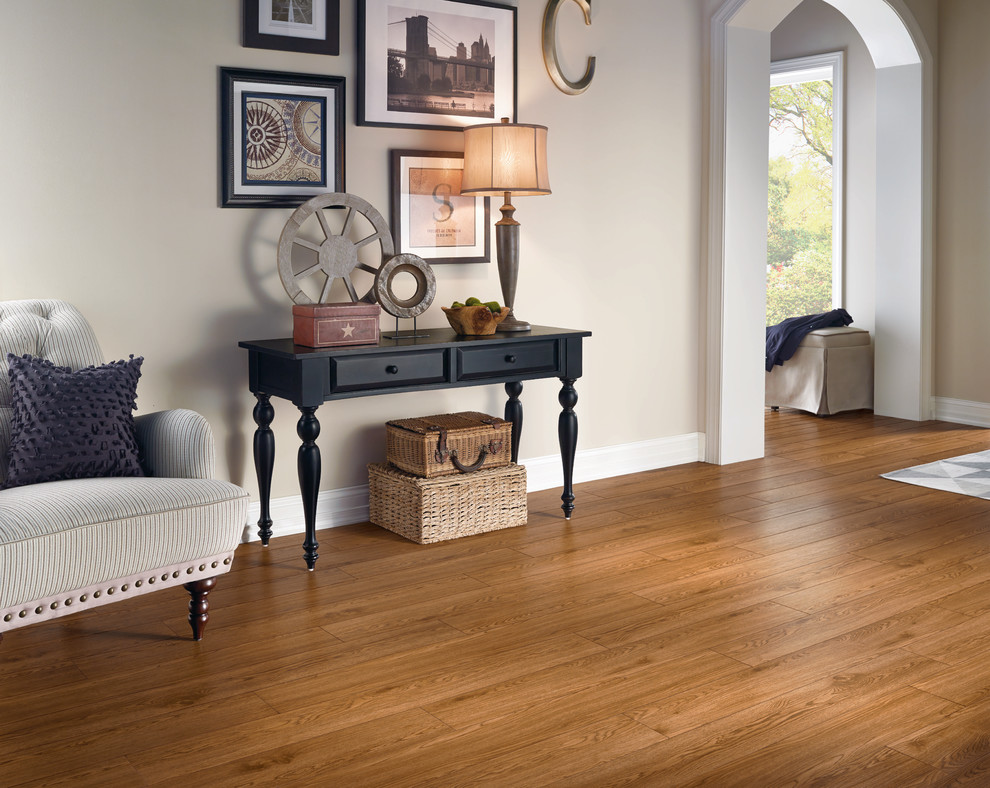 Mid-sized transitional light wood floor and brown floor entryway photo with beige walls