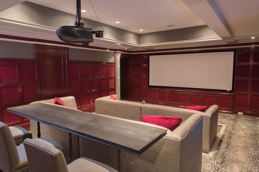 Photo of a traditional home theatre in Other with red walls, carpet and a projector screen.