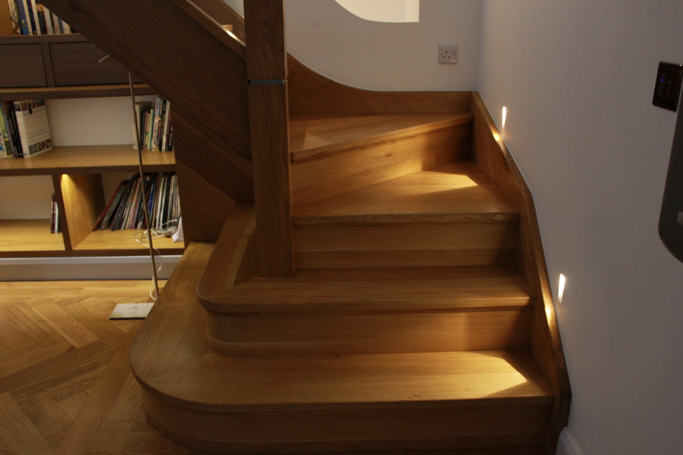 Inspiration for a small contemporary wood staircase in Manchester.