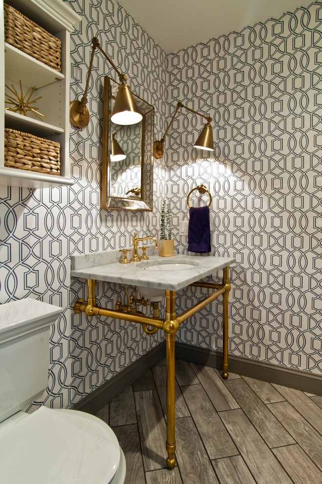Design ideas for a transitional powder room in Chicago with a two-piece toilet, blue walls and a console sink.