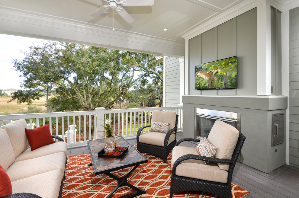 This is an example of a traditional verandah in Charleston with a fire feature, decking and a roof extension.