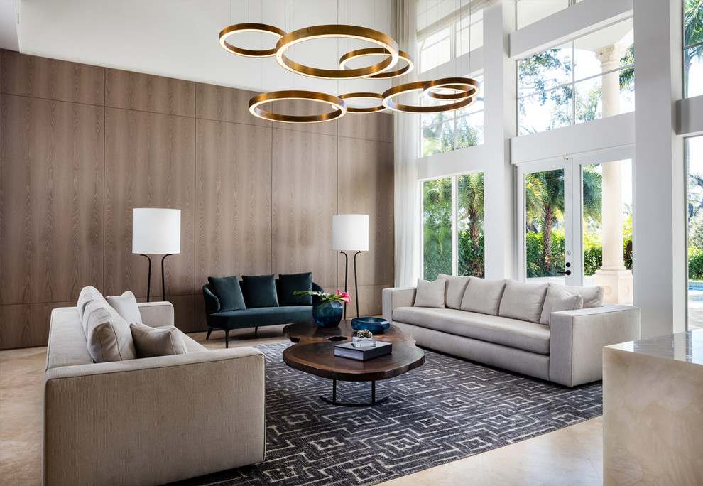 Design ideas for a large contemporary open concept living room in Miami with white walls, beige floor and porcelain floors.