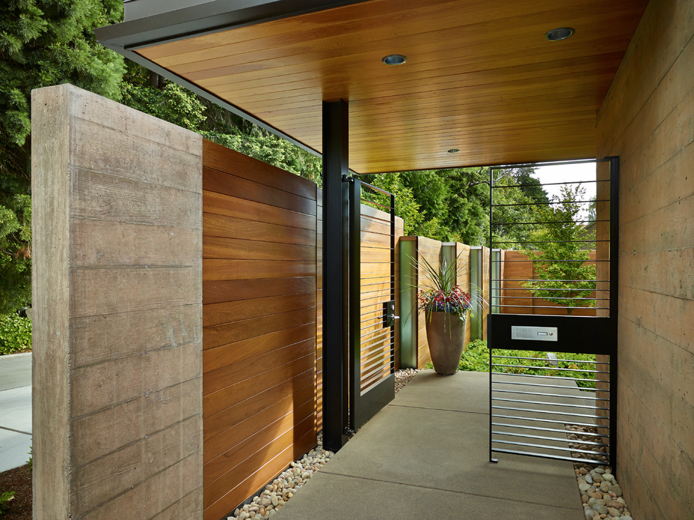 Inspiration for a contemporary front door in Seattle with a metal front door.