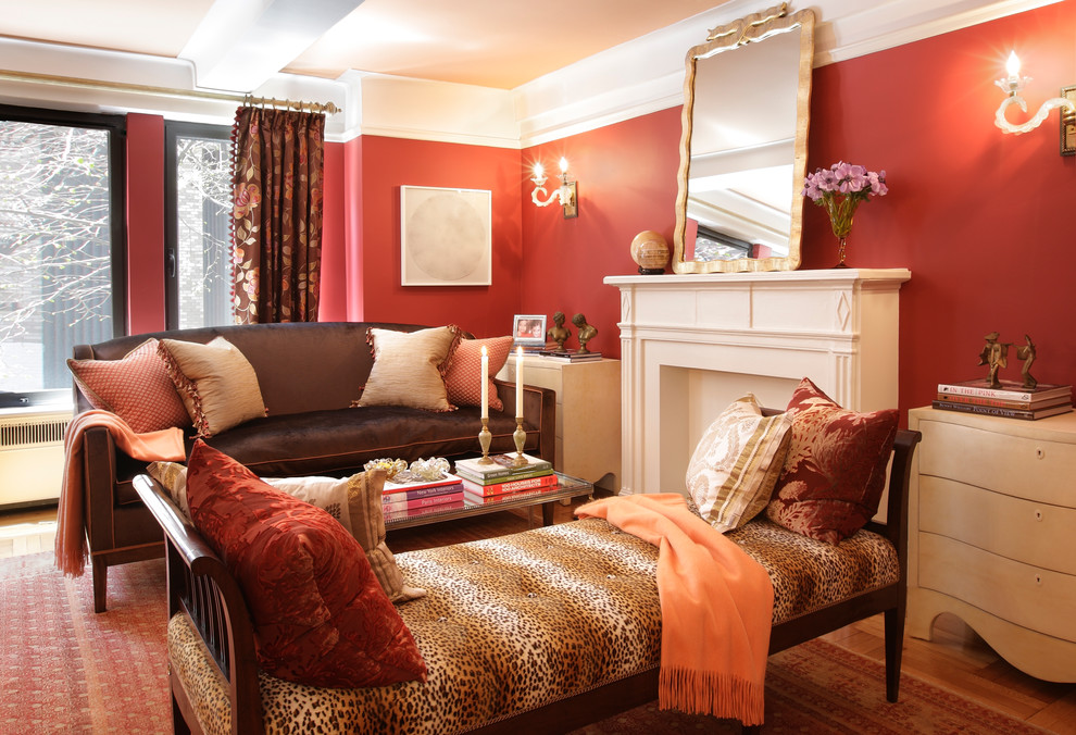 Design ideas for a traditional living room in New York with red walls.