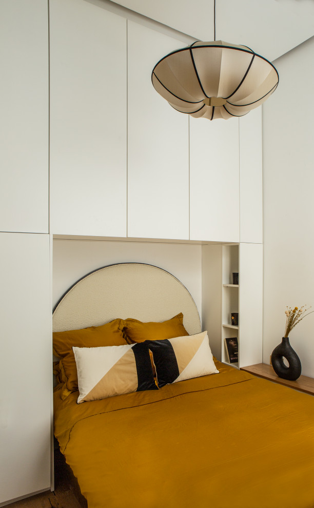 Photo of a small world-inspired master bedroom in Paris with white walls and no fireplace.