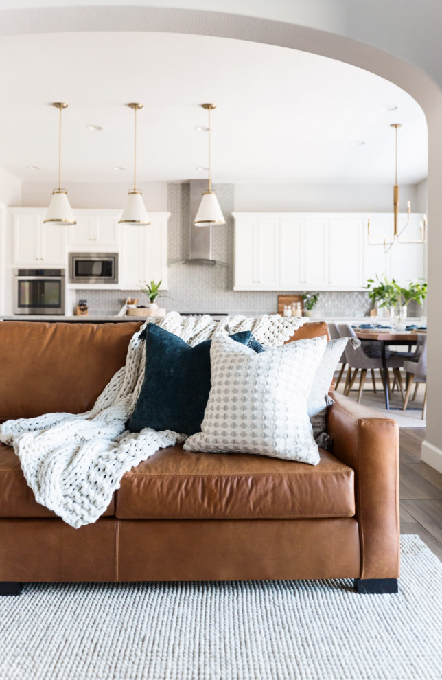 Family room - contemporary open concept brown floor family room idea in Phoenix with white walls