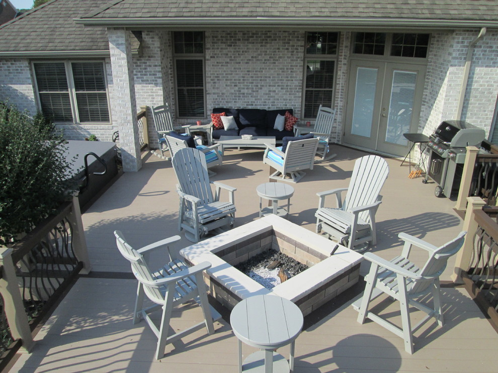 Patio - mid-sized transitional backyard patio idea with a fire pit