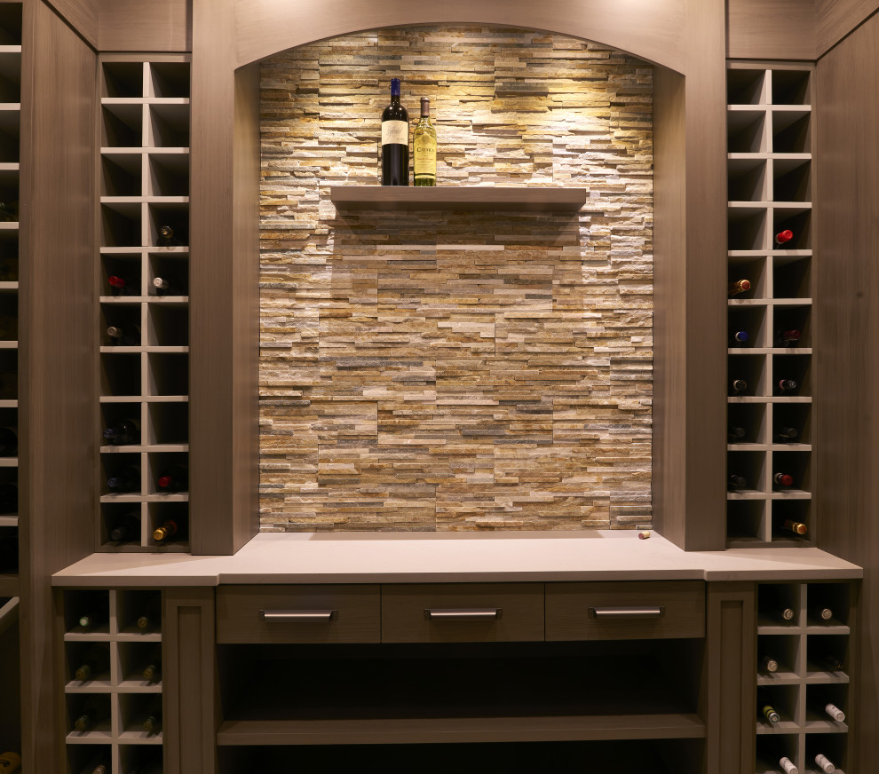 This is an example of a mid-sized modern wine cellar in Other with medium hardwood floors, storage racks and brown floor.