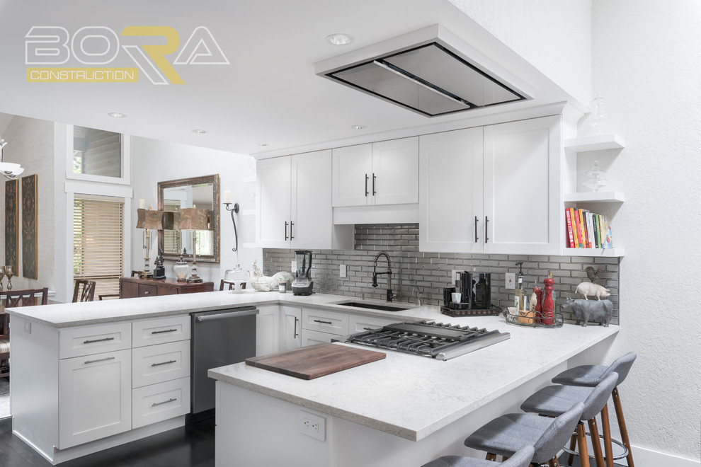Inspiration for a mid-sized transitional u-shaped dark wood floor and brown floor eat-in kitchen remodel with an undermount sink, recessed-panel cabinets, white cabinets, wood countertops, metallic backsplash, ceramic backsplash, stainless steel appliances and a peninsula