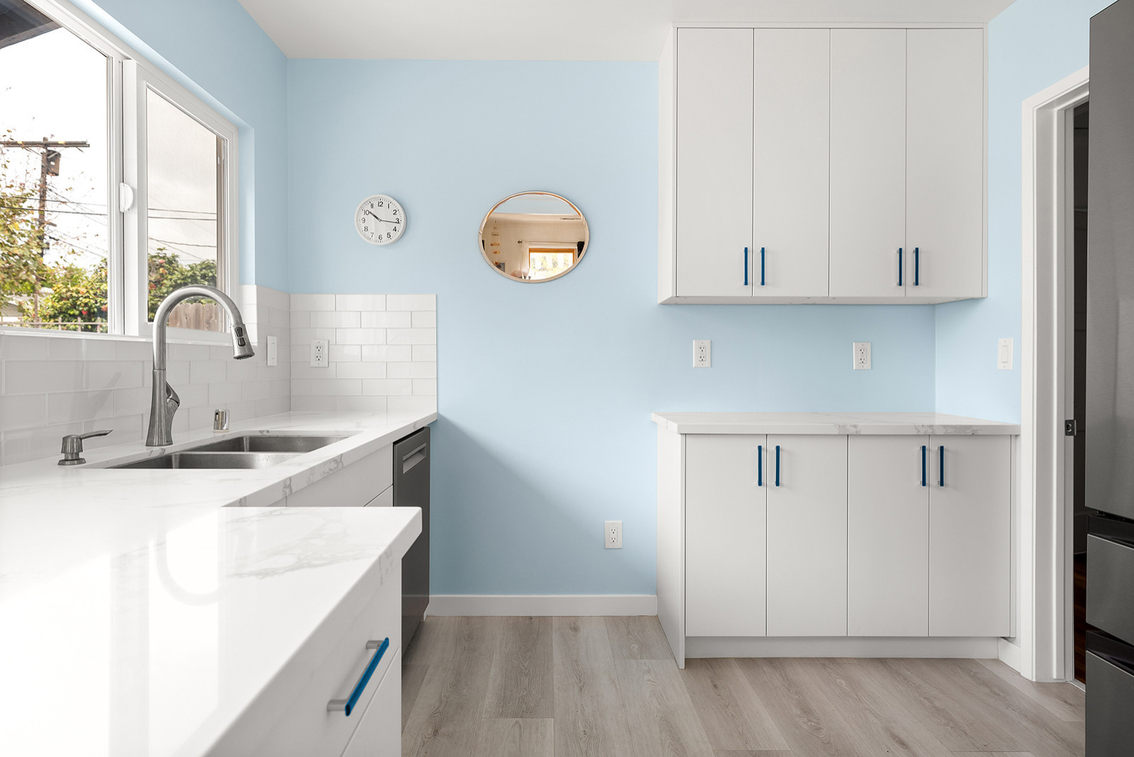 Countertops, Tile Backsplash, Cabinetry, Plank Vinyl Flooring and Appliances