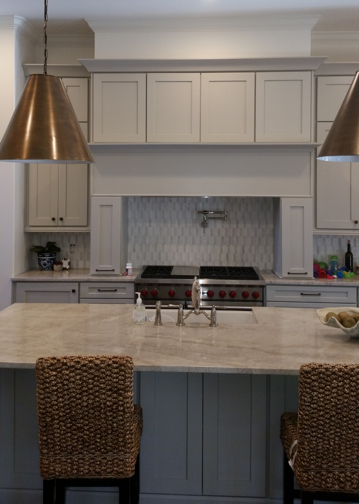Eat-in kitchen - mid-sized transitional eat-in kitchen idea in Birmingham with shaker cabinets, gray cabinets, gray backsplash, stainless steel appliances and an island