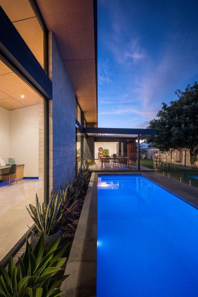 Design ideas for a mid-sized contemporary courtyard rectangular pool in Adelaide.