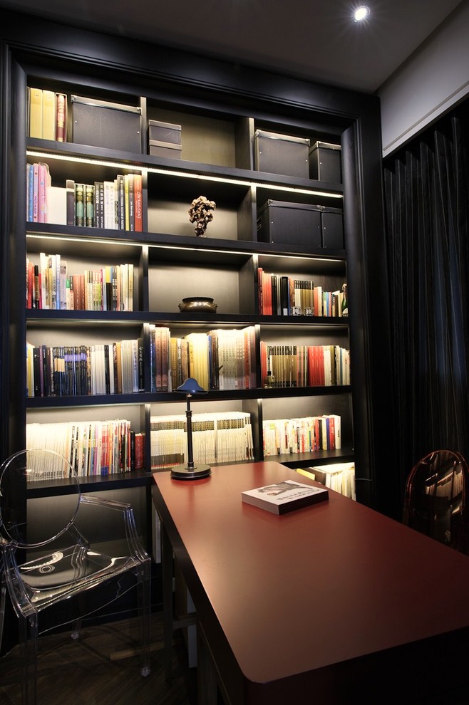 Photo of a contemporary home office in New York with black walls.