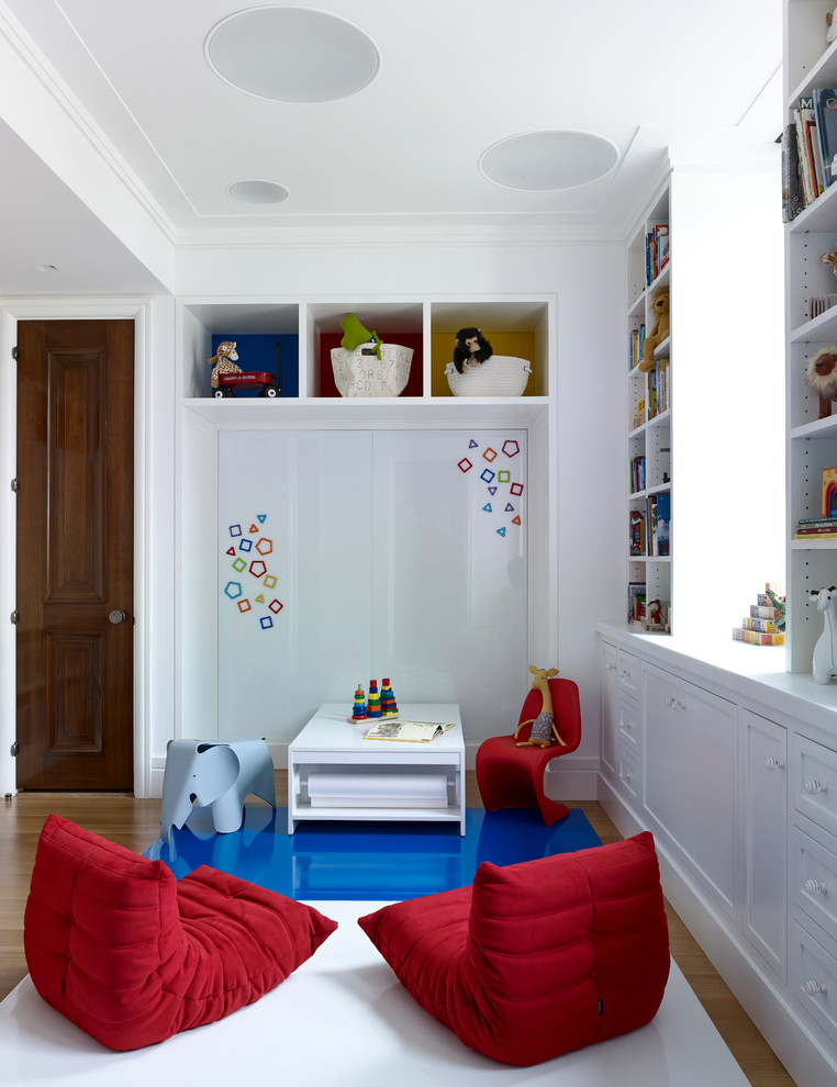 This is an example of a transitional gender-neutral kids' playroom in New York with white walls.