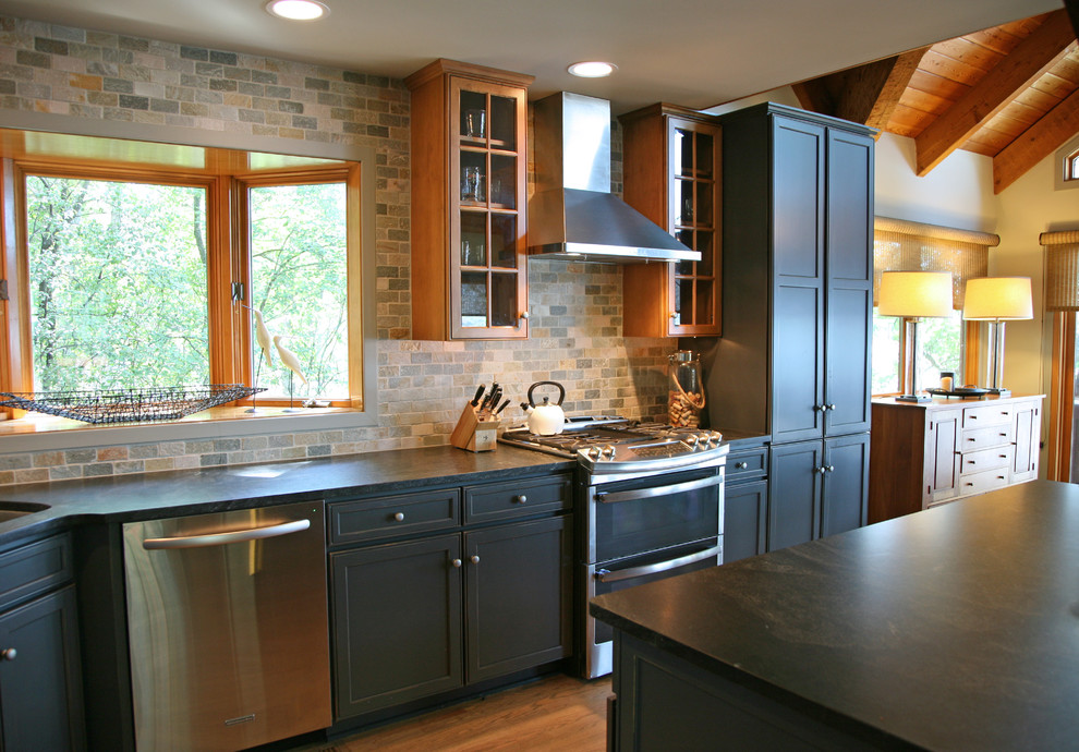 Inspiration for a country kitchen in Milwaukee with light hardwood floors and soapstone benchtops.