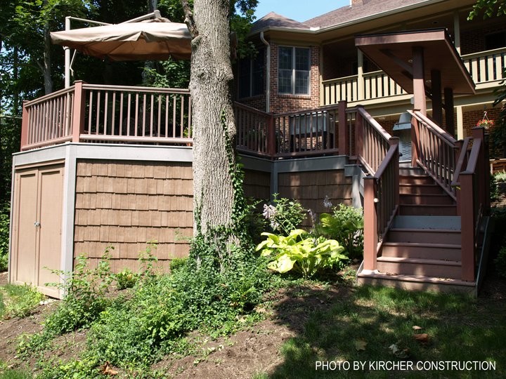 Deck - large craftsman backyard deck idea in Cincinnati with a pergola