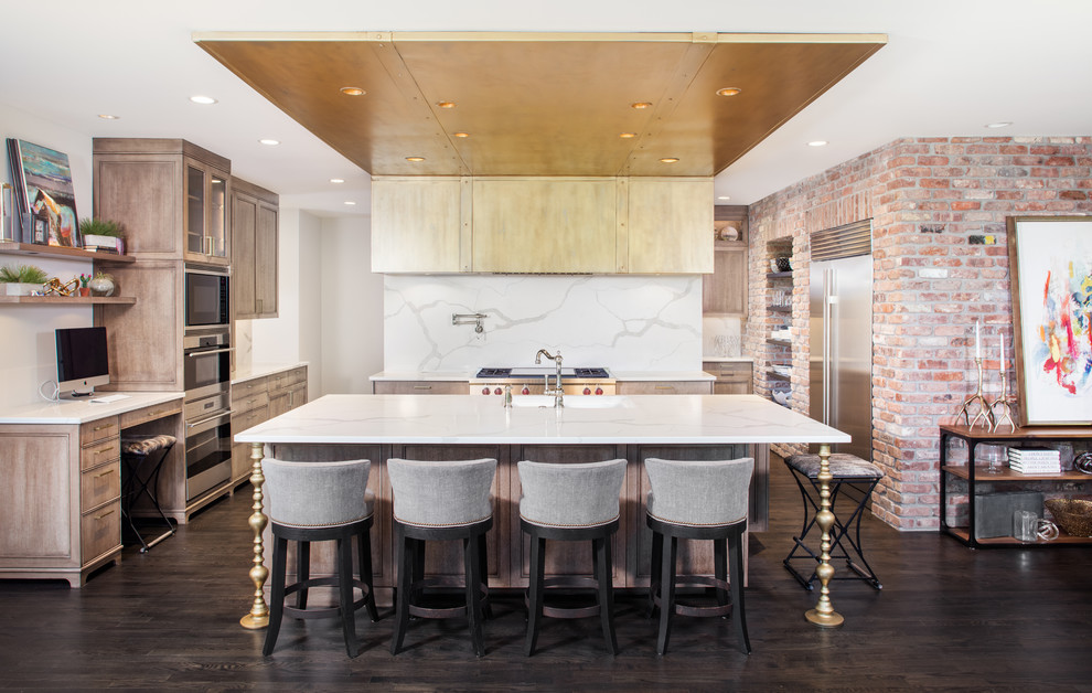 This is an example of an eclectic galley open plan kitchen in Omaha with recessed-panel cabinets, light wood cabinets, white splashback, black appliances, dark hardwood floors, with island and brown floor.