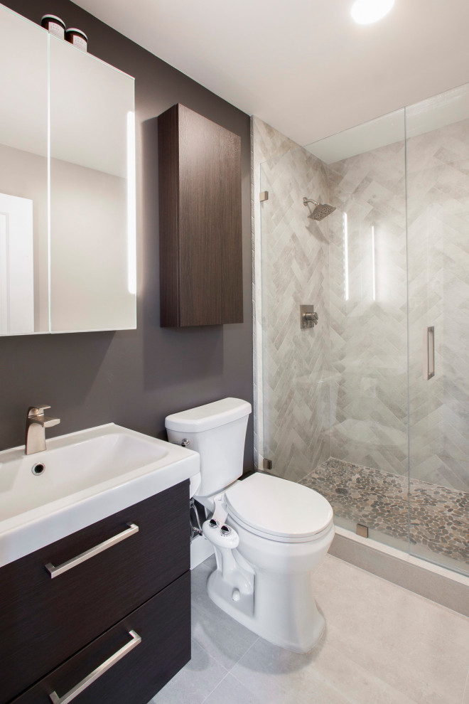 Mid-sized contemporary 3/4 bathroom in Sacramento with flat-panel cabinets, dark wood cabinets, an alcove shower, a two-piece toilet, gray tile, grey walls, porcelain floors, an integrated sink, beige floor, a hinged shower door, white benchtops, a single vanity and a floating vanity.