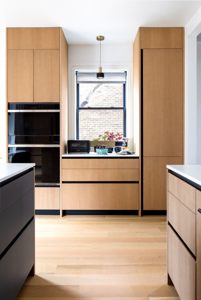 Foto di una cucina minimalista con ante in legno scuro, top in quarzo composito e top bianco