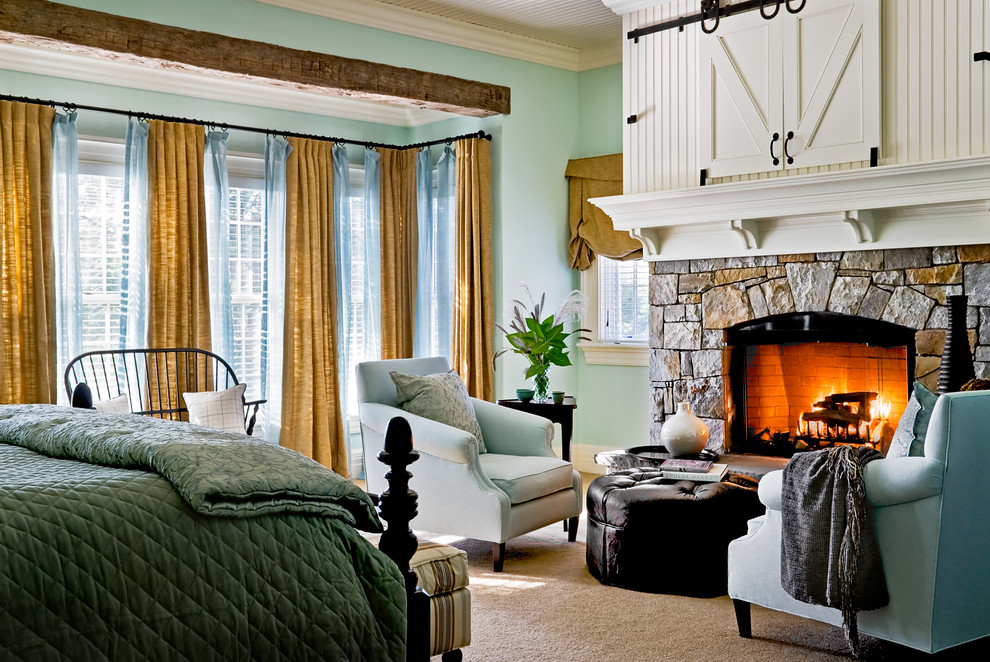 Inspiration for a traditional bedroom in New York with a stone fireplace surround and a standard fireplace.