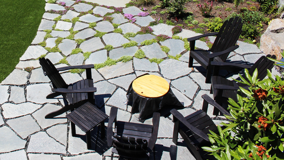 Design ideas for a large transitional partial sun backyard stone formal garden in Seattle for summer.