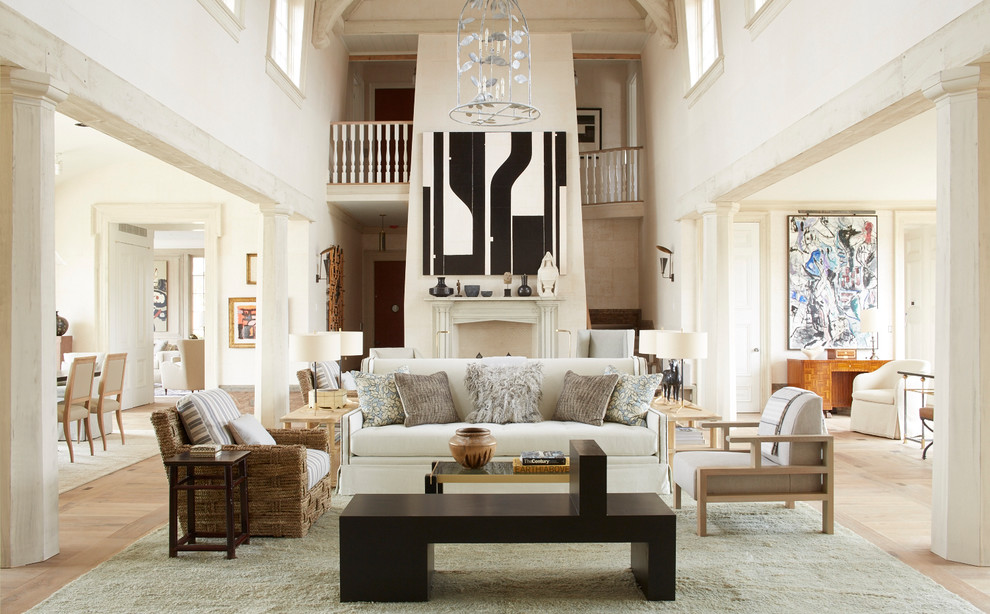 Example of a huge transitional open concept light wood floor and beige floor living room design in Jacksonville with beige walls, a standard fireplace, a concrete fireplace and no tv