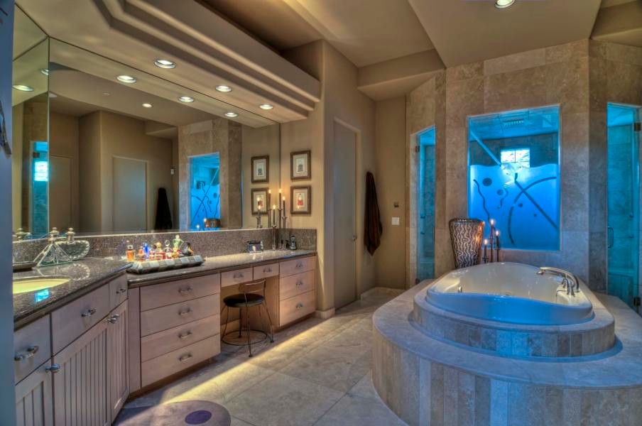Example of a huge transitional master white tile and porcelain tile porcelain tile drop-in bathtub design in Phoenix with flat-panel cabinets, medium tone wood cabinets, a one-piece toilet, beige walls, a drop-in sink and granite countertops