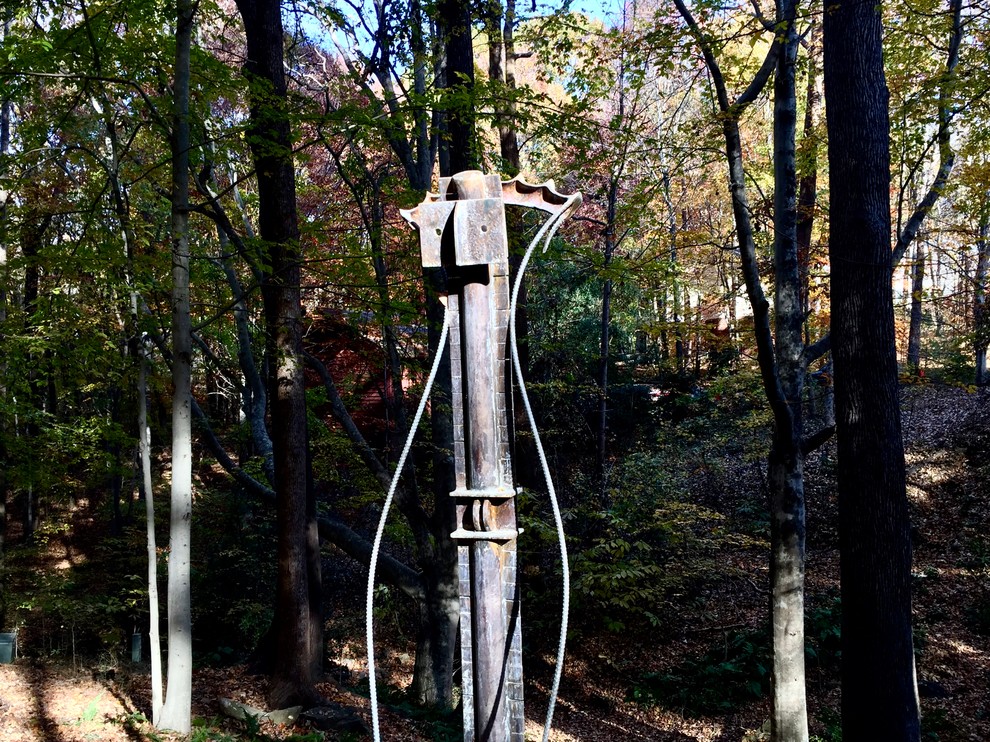 Industrial sculpture blends with the forest