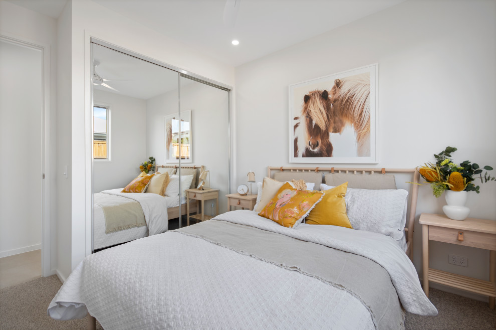 This is an example of a contemporary bedroom in Sunshine Coast.
