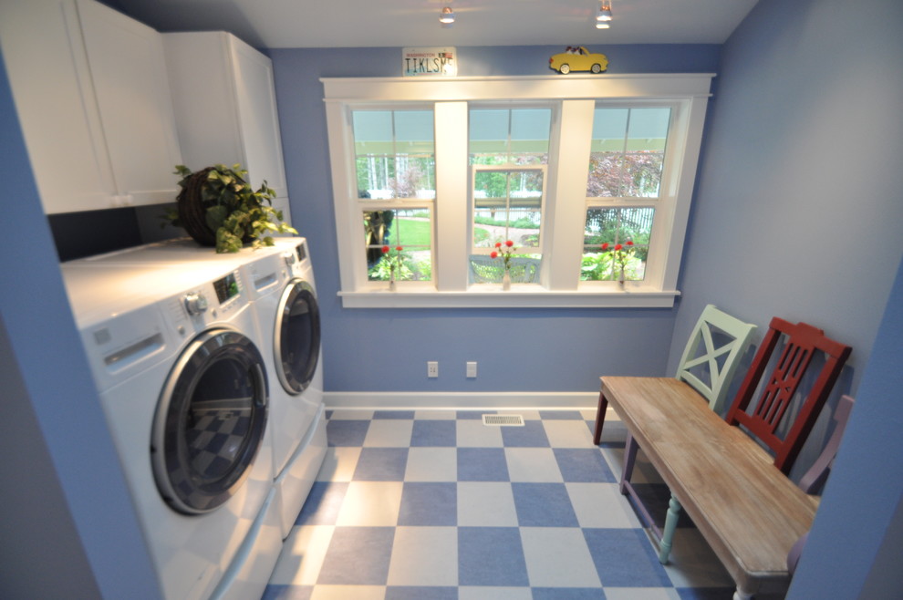 Expansive transitional laundry room in Seattle.