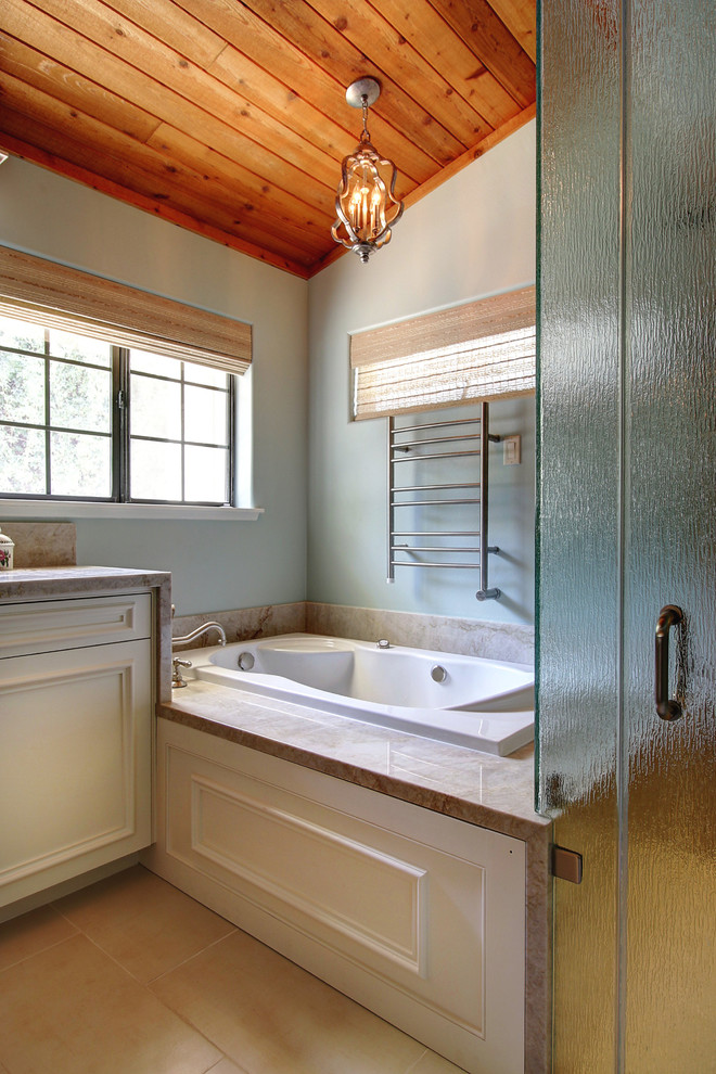 Mid-sized transitional master bathroom in Santa Barbara with a hot tub, a curbless shower, green walls, an undermount sink, quartzite benchtops, beige tile, porcelain floors, white cabinets, recessed-panel cabinets, brown floor and a hinged shower door.