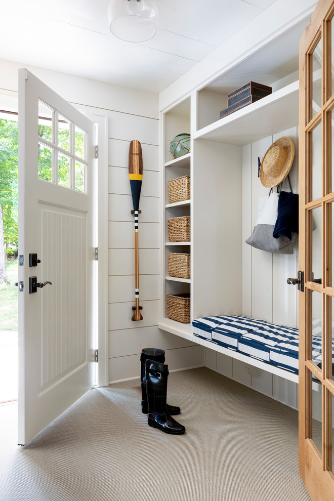 Photo of a small beach style mudroom in Minneapolis with white walls, carpet, a single front door, a white front door, beige floor, timber and planked wall panelling.