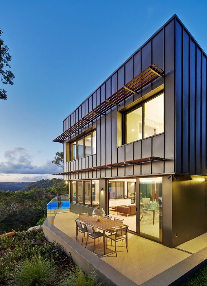 Design ideas for a contemporary exterior in Sydney with metal siding.
