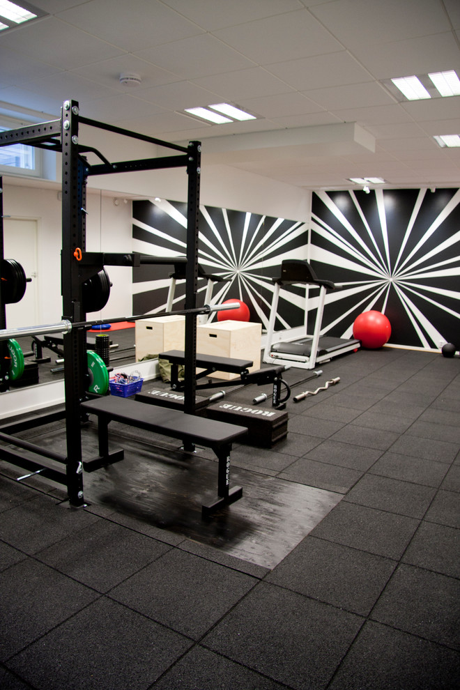 Design ideas for a modern home gym in Raleigh.